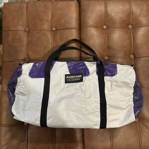 Purple and white RAREFORM duffle bag, made from billboards, one of a kind